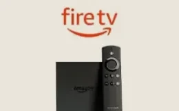 Amazon Fire TV Stick with its remote